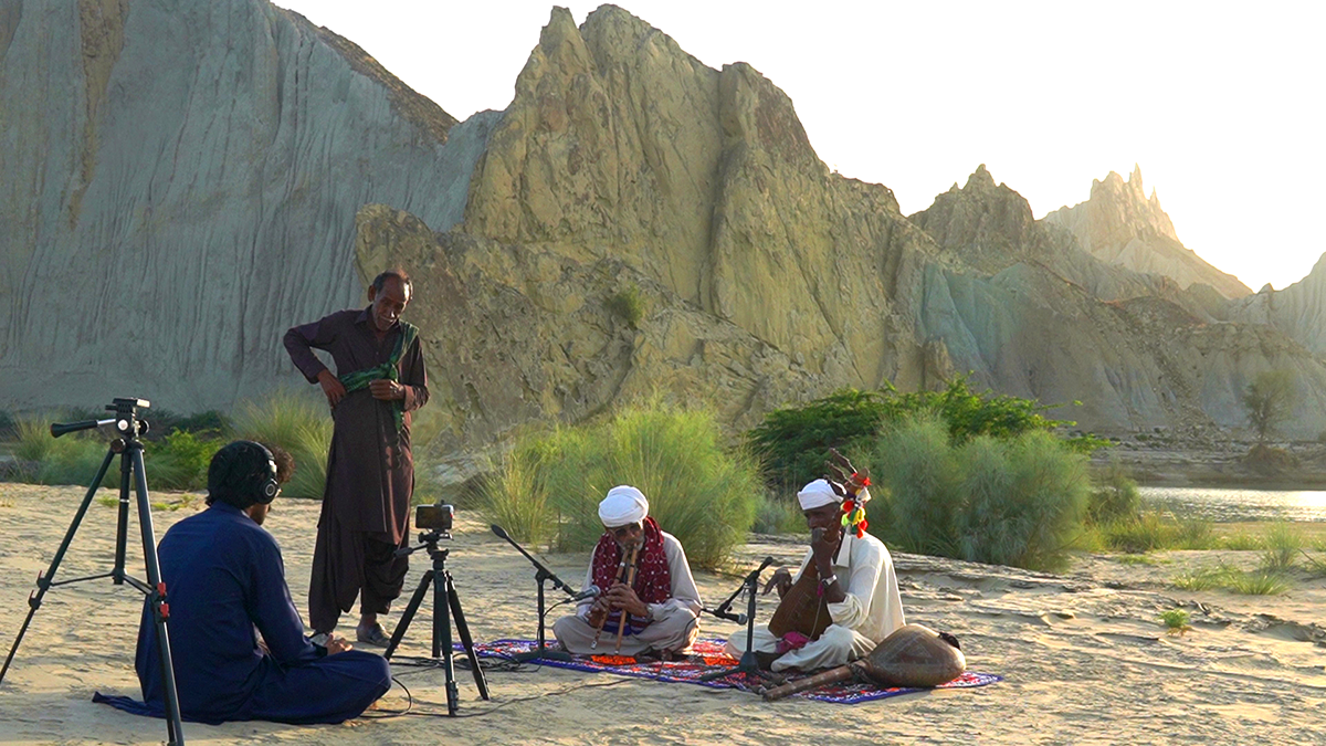 A recording session in a rural, desert-like environment